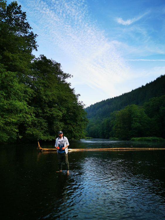 Angler fly fishing on a river